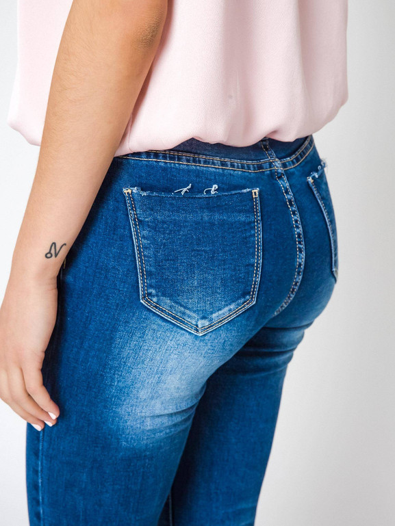 Jeansy zdobione przecięciami i dżetami na kolanach granatowe